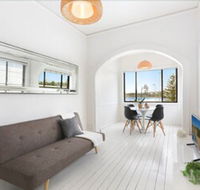 Minimalist Beachfront Apartment - Accommodation Guide